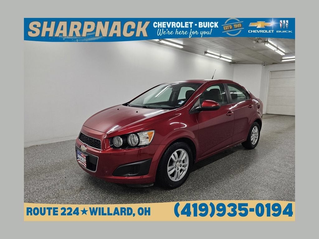 2012 Chevrolet Sonic LS in Crystal Red Tintcoat — front three-quarter view