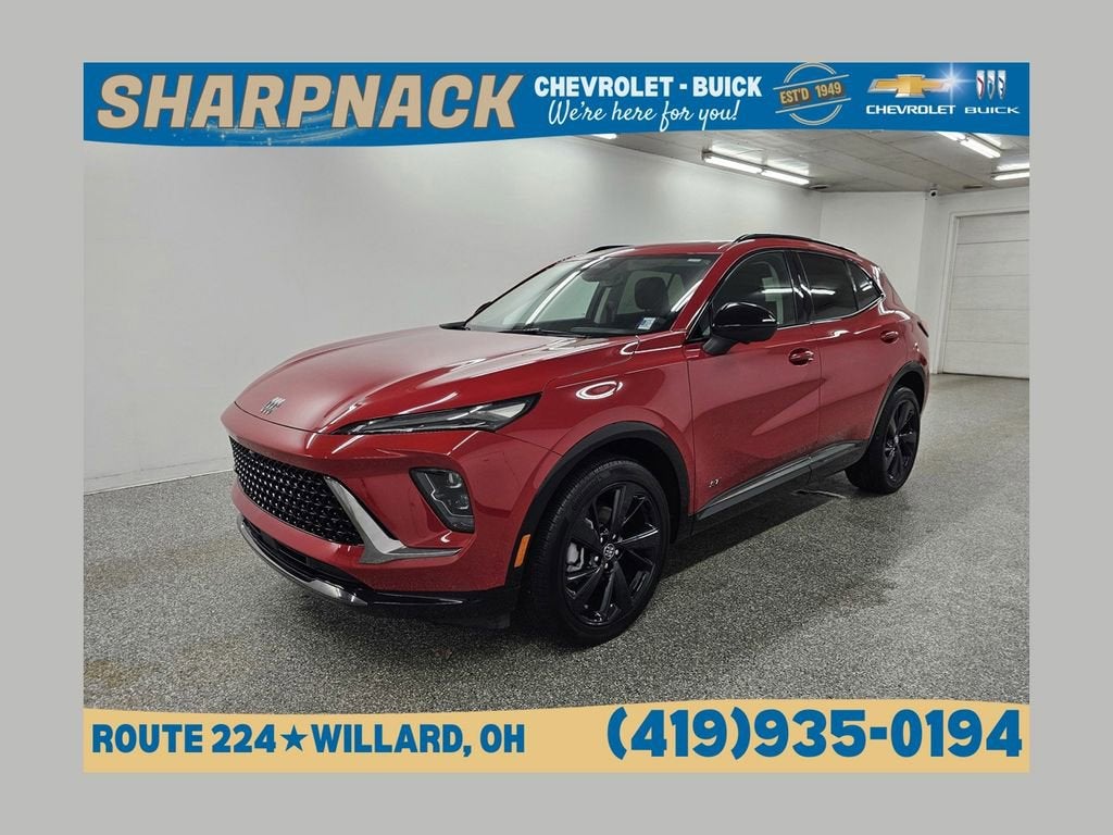 2025 Buick Envision Sport Touring in Brilliant Red — front three-quarter view