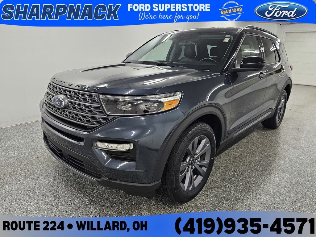 2022 Ford Explorer XLT in Stone Blue Metallic — front three-quarter view