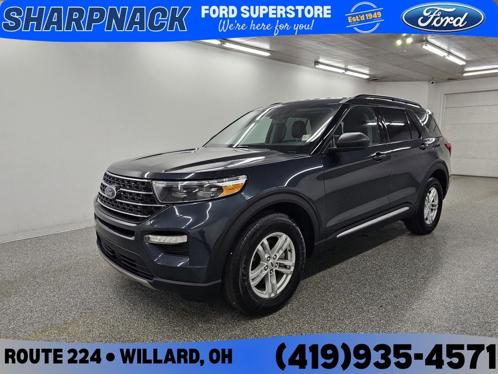 2023 Ford Explorer XLT in Stone Blue Metallic — front three-quarter view